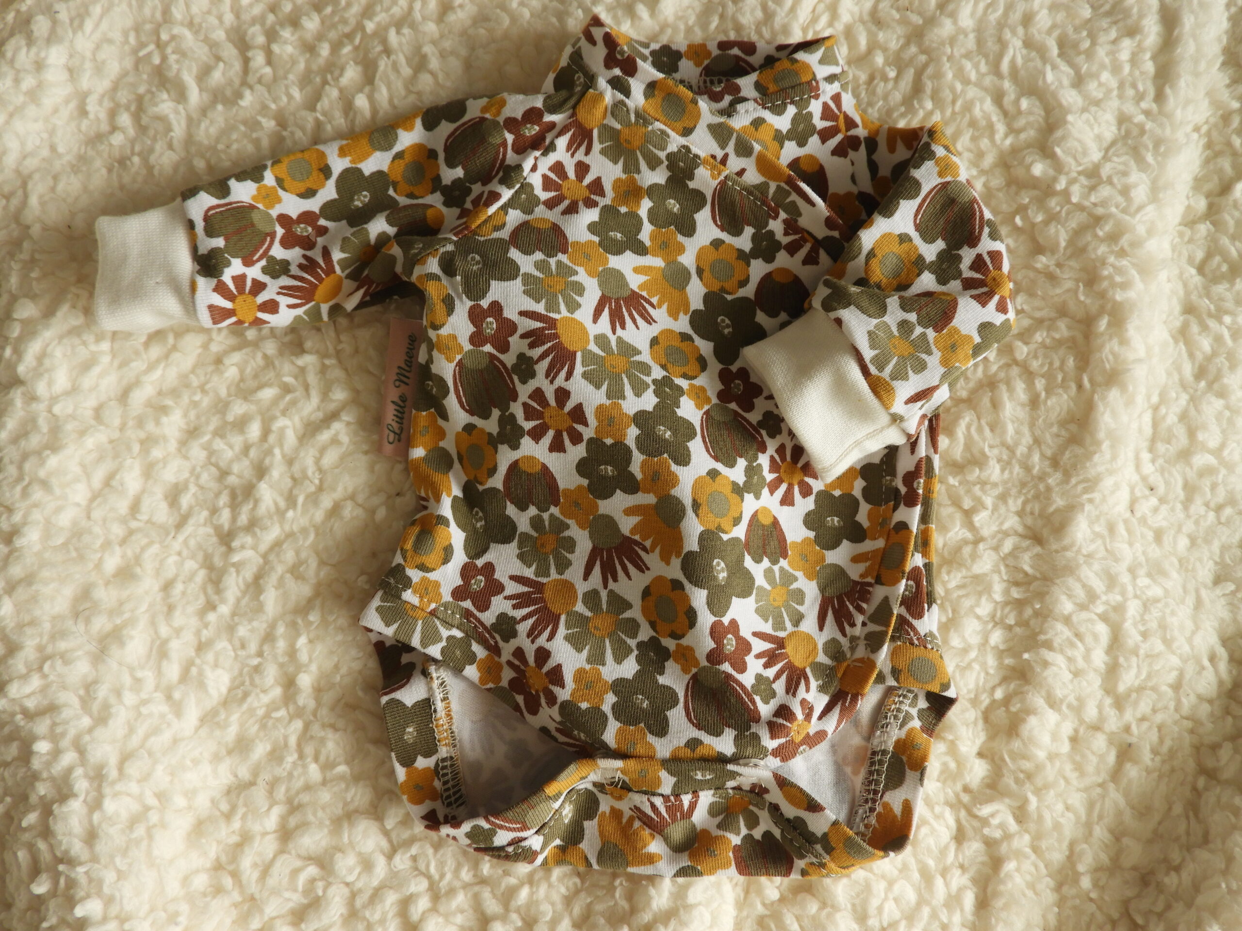 prematuur oker/olijf bloem rompertje